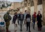 Participants of the Palestine festival of Literature walk through Hebron amidst the Israeli military. (Photo: Via Mondoweiss)