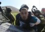 Israeli troops detain a Palestinian journalist at a protest against the illegal settlement outpost of Adei Ad in the northern West Bank. (Photo: Oren Ziv, Activestills.org, file)