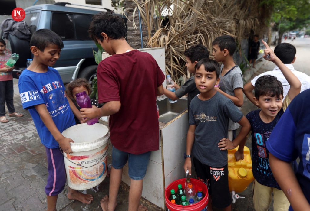 Smiling in the Time of Genocide, Gaza Children Looking for Water PHOTOS Palestine Chronicle