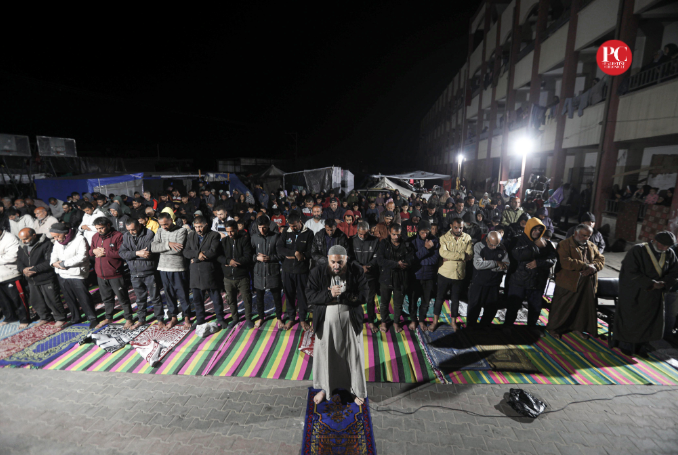 Displaced Palestinians in Rafah take part in the first mass prayer of Ramadan. (Photo: Mahmoud Ajjour, The Palestine Chronicle)